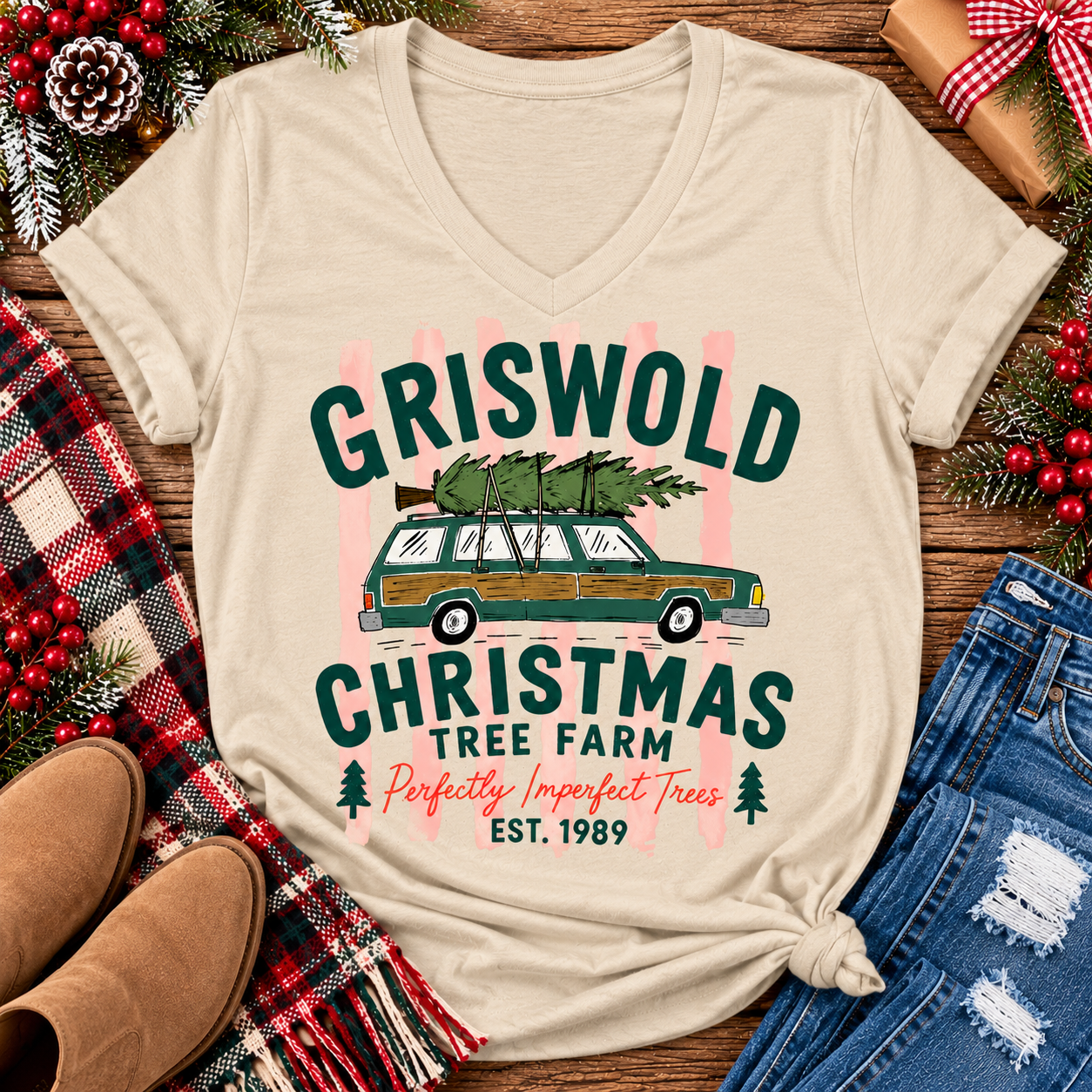 Christmas graphic tee featuring Griswold Christmas Tree Farm vintage green station wagon with Christmas tree and retro lettering.