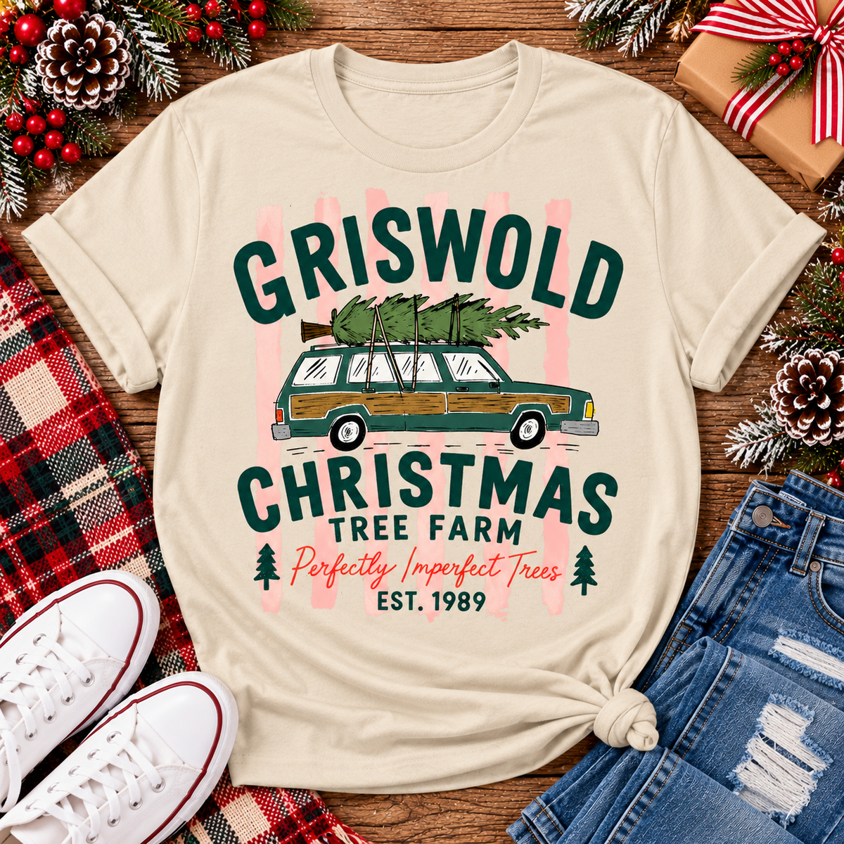 Christmas graphic tee featuring Griswold Christmas Tree Farm vintage green station wagon with Christmas tree and retro lettering.