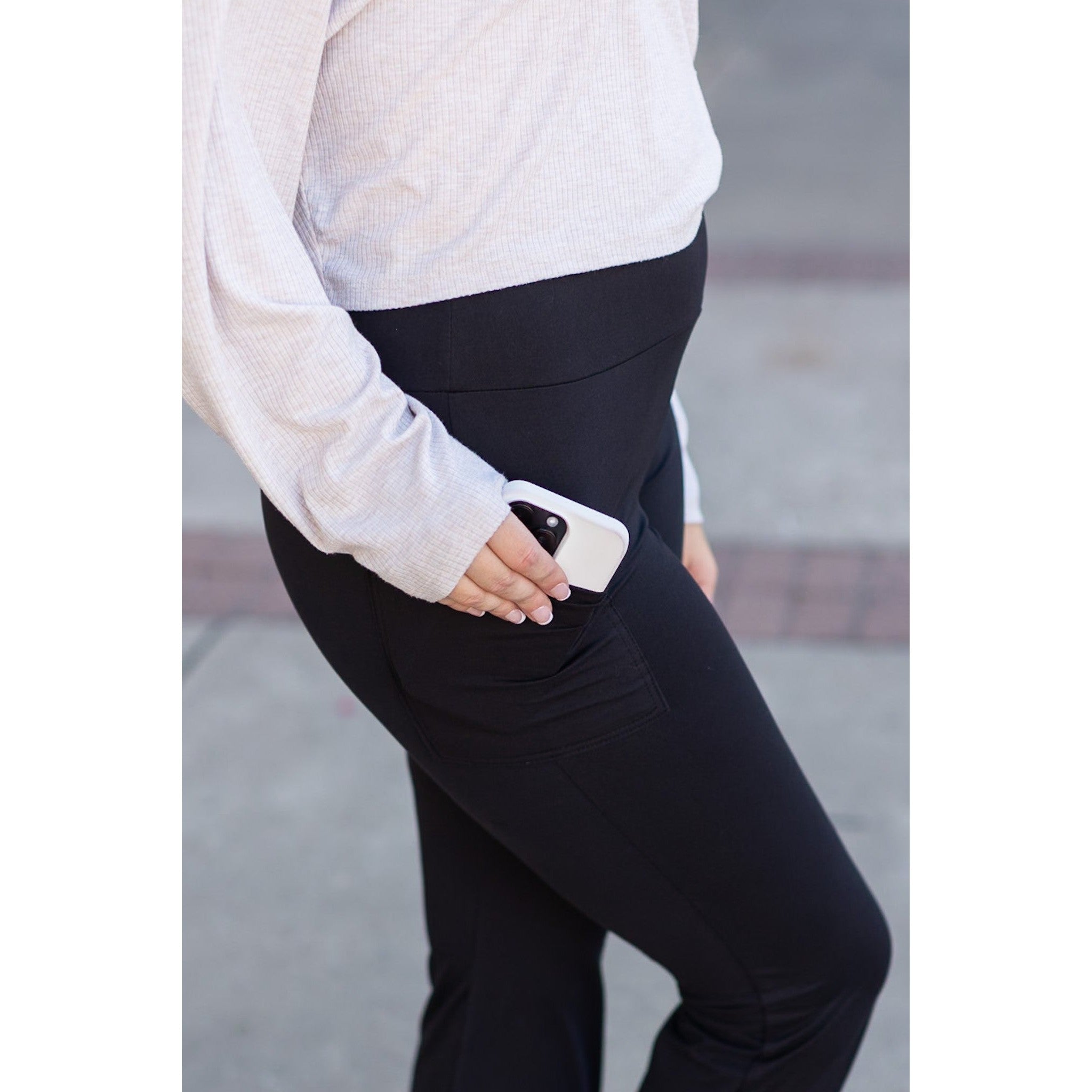High-waisted black bootcut leggings by Julia Rose, Julia Rose women’s flared black leggings lifestyle image