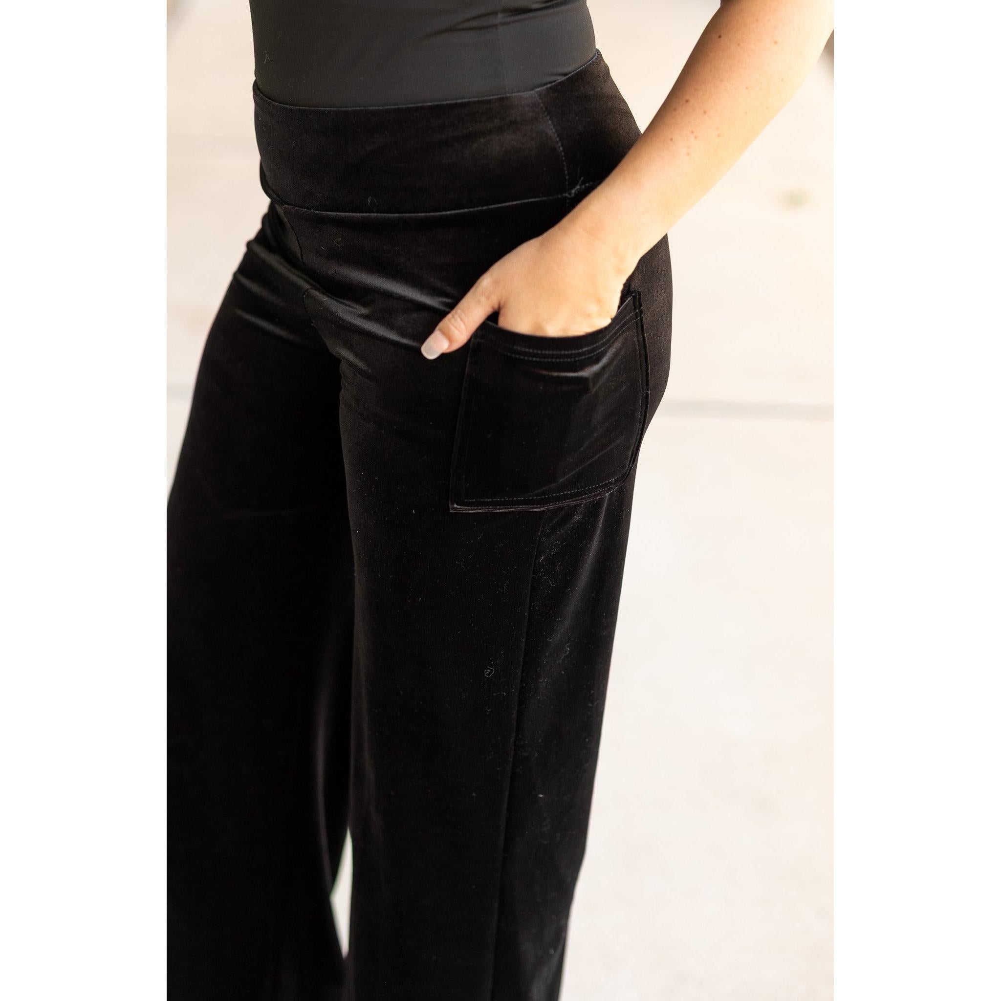 Women’s flowy velvet wide leg holiday pants. Velvet wide leg trousers styled for holiday outfits