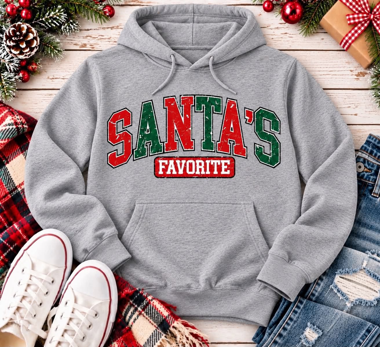 Grey Santa's Favorite Christmas pullover hoodie with vintage distressed red and green varsity lettering, festive holiday graphic apparel.
