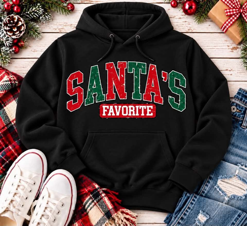 Black Santa's Favorite Christmas pullover hoodie with vintage distressed red and green varsity lettering, festive holiday graphic apparel.