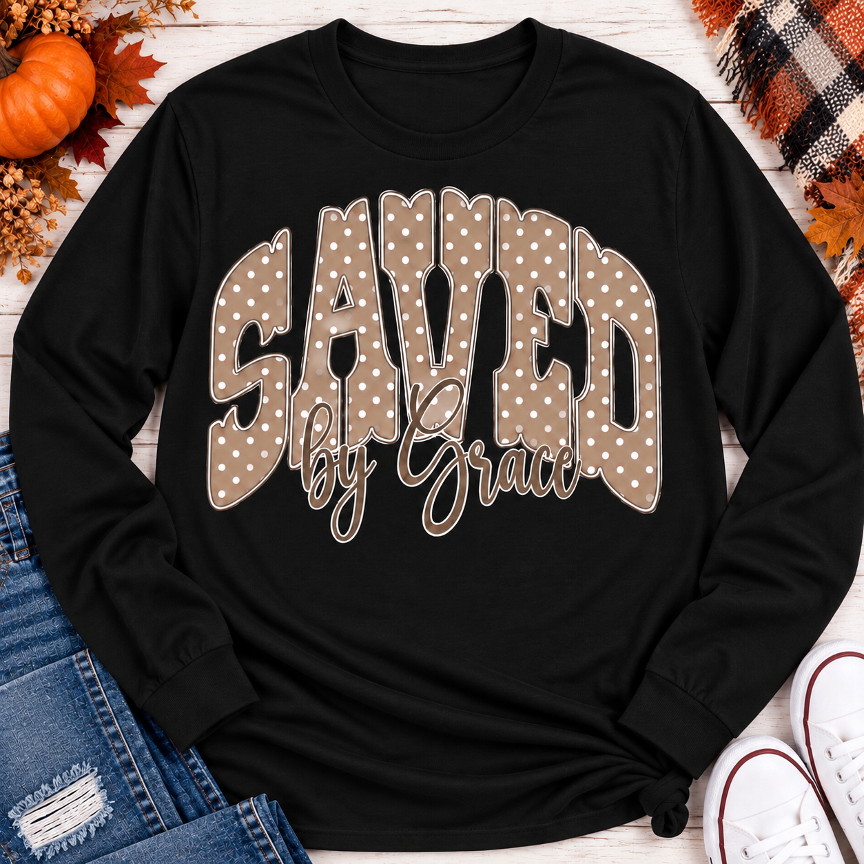Saved by Grace faith graphic apparel with polka dot lettering, available in brown, navy and black V-neck, long sleeve, crewneck and hoodie styles.