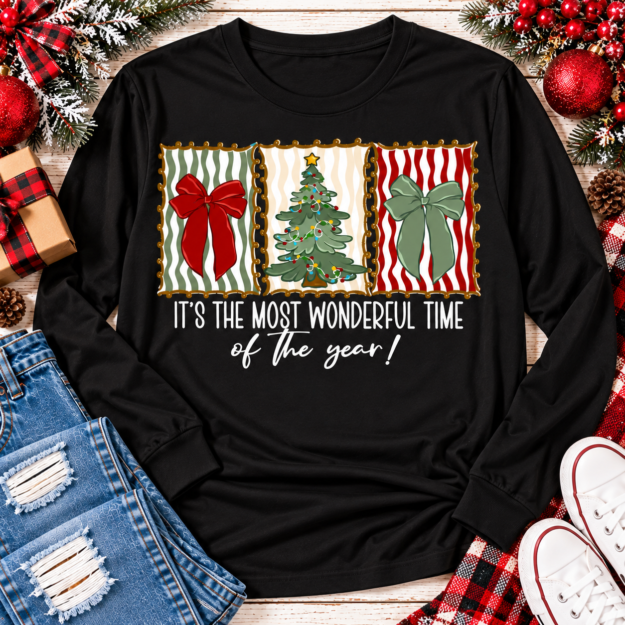 Black long sleeve Christmas graphic shirt featuring vintage-inspired red and green bows, Christmas tree and festive holiday saying.