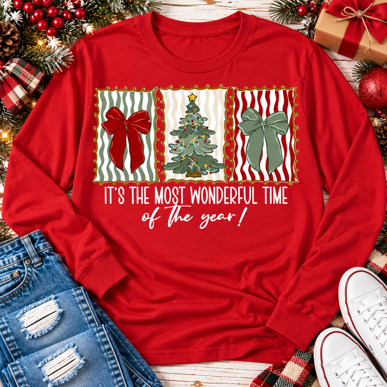 Red long sleeve Christmas shirt with festive bows, Christmas tree and It's the Most Wonderful Time of the Year graphic.