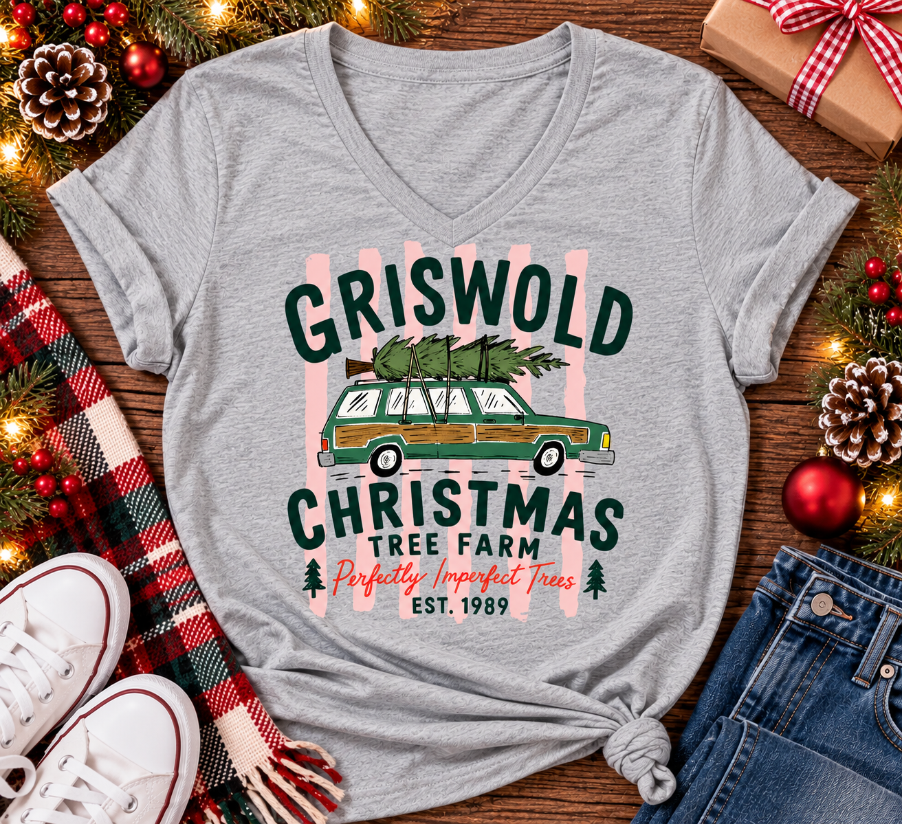 Christmas graphic tee featuring Griswold Christmas Tree Farm vintage green station wagon with Christmas tree and retro lettering.
