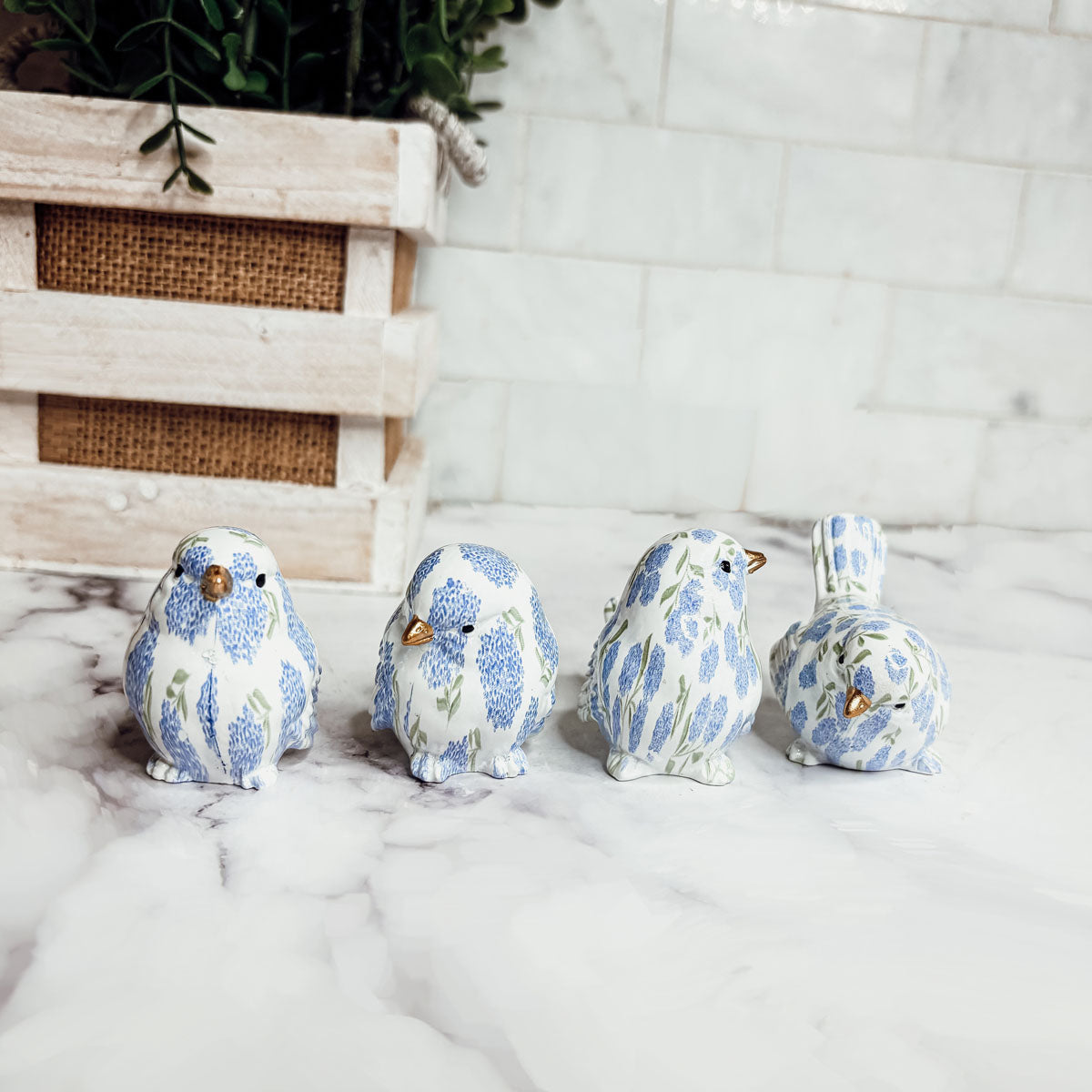 Stylish bird home decor items, such as resin figurines and bird-patterned accessories, enhancing your living area