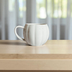 Autumn housewarming gifts - white and orange pumpkin coffee cups