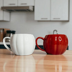 Unique fall home decor gifts - white and orange pumpkin coffee mugs for seasonal decorating