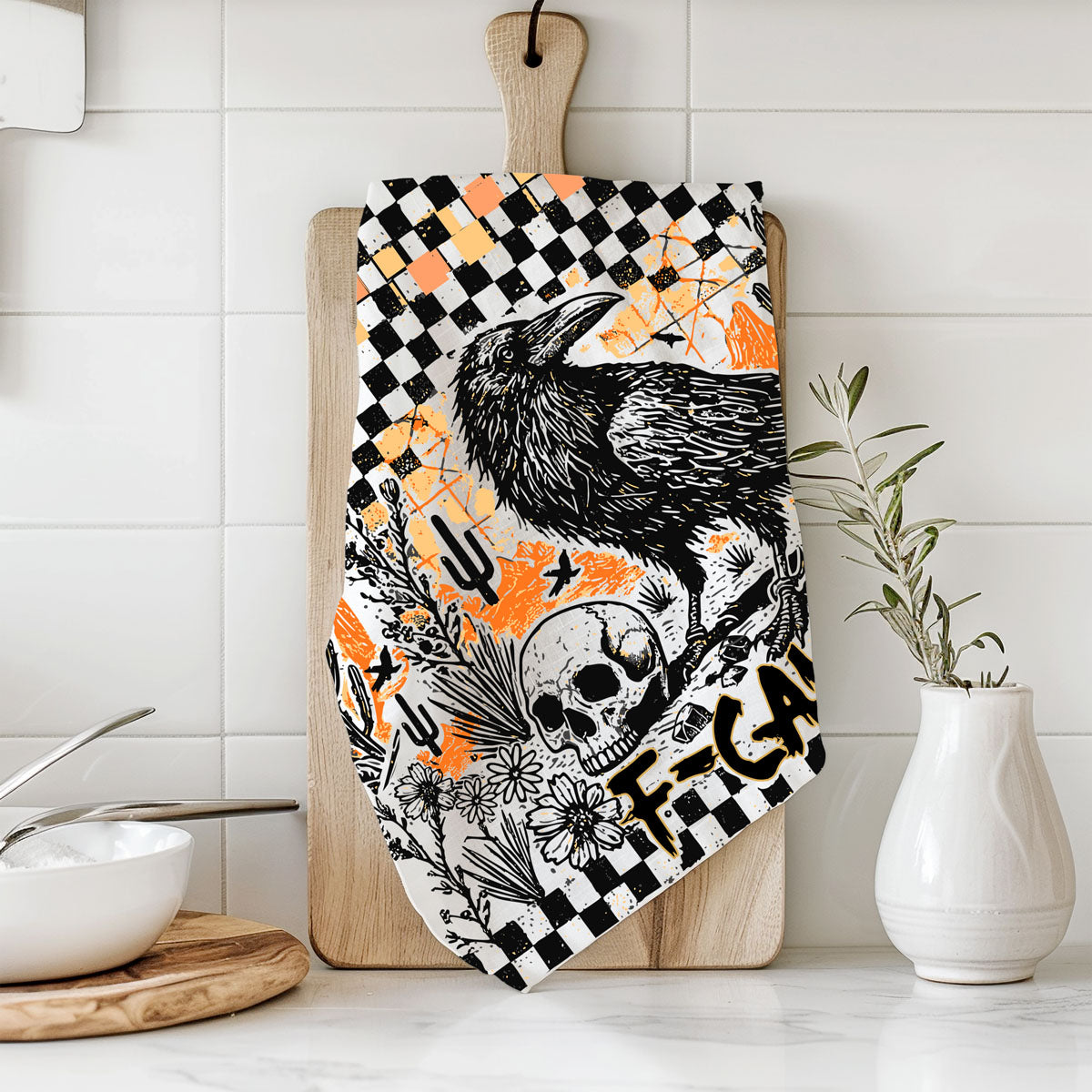 edgy fall kitchen towel with crow skull and checkered border
funny fall tea towel for halloween parties crow design
black bird halloween hand towel with orange grunge background
crow and jack o lantern style skull towel for spooky décor
witchy fall kitchen towel with raven and skull print