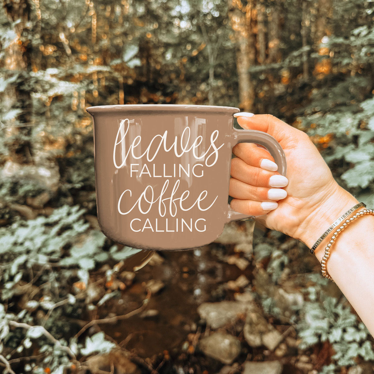 leaves falling coffee calling mug used as fall kitchen accent
cozy autumn corner with chair blanket and brown coffee mug
fall inspired flatlay featuring brown quote mug and foliage
brown ceramic autumn mug in boho style kitchen
leaves falling coffee calling mug paired with fall dish towel