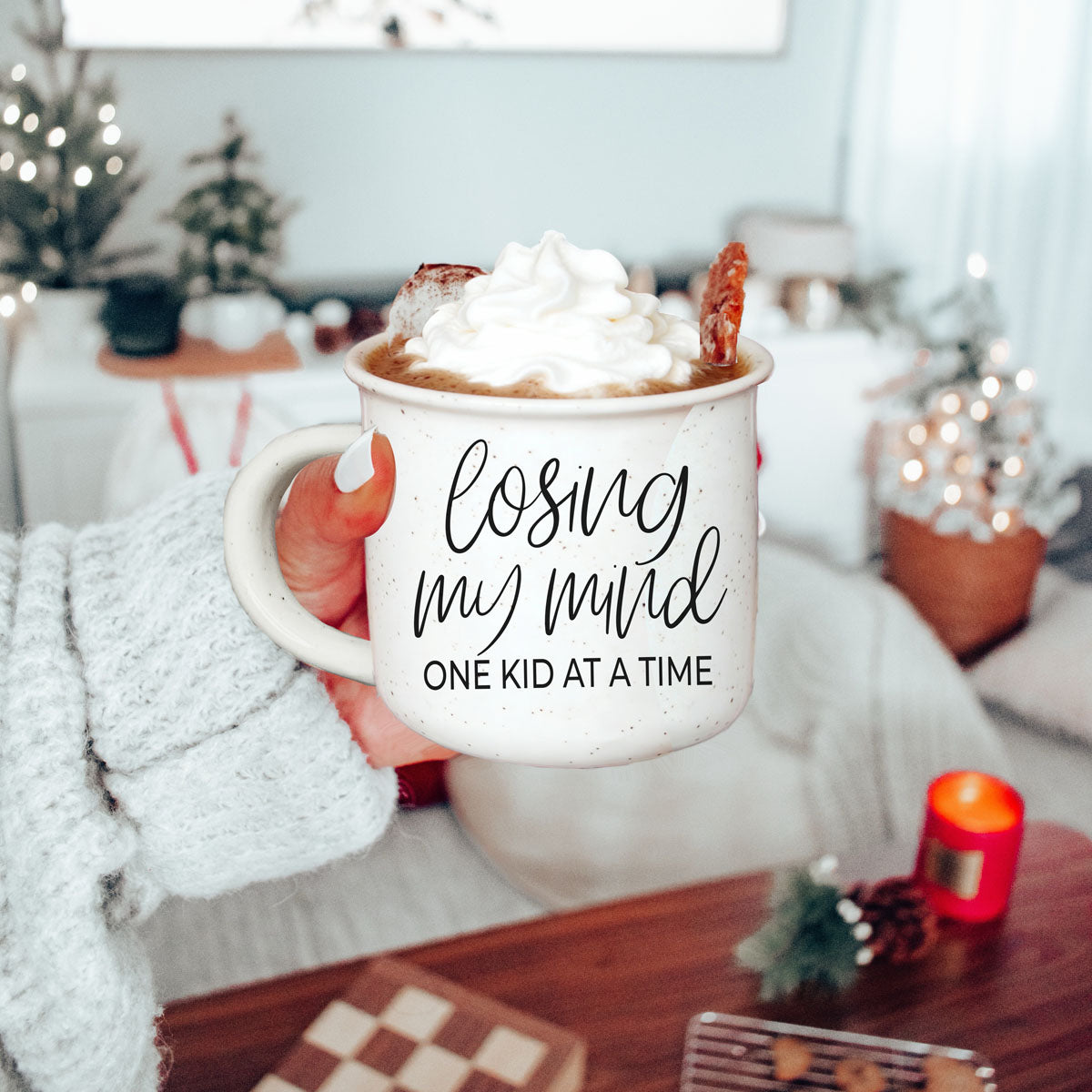 honest mom life coffee cup with playful saying
cute gift for mom who laughs through chaos
funny mug for moms who are mentally done
cozy sweatshirt and motherhood quote mug photo
mom coffee bar decor with losing my mind mug
gift for new mom learning the chaos of kids