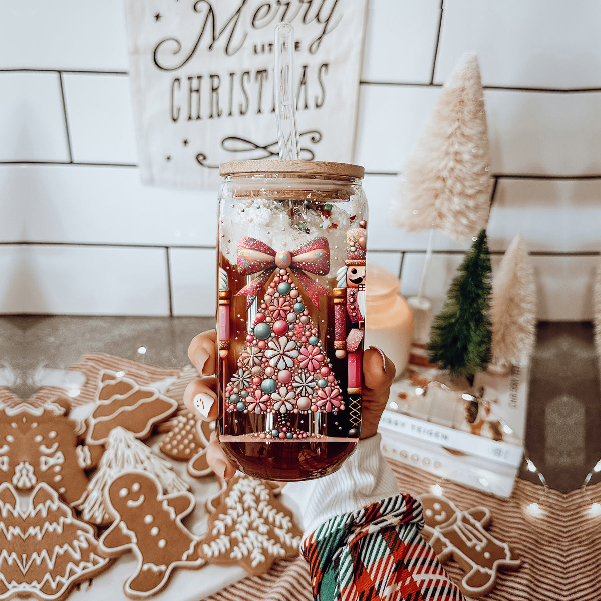Sparkly Christmas coffee tumbler – boho Nutcracker soldiers and tree design
Holiday coffee bar decor – glass cup with Christmas tree, bow, floral accents, and glitter