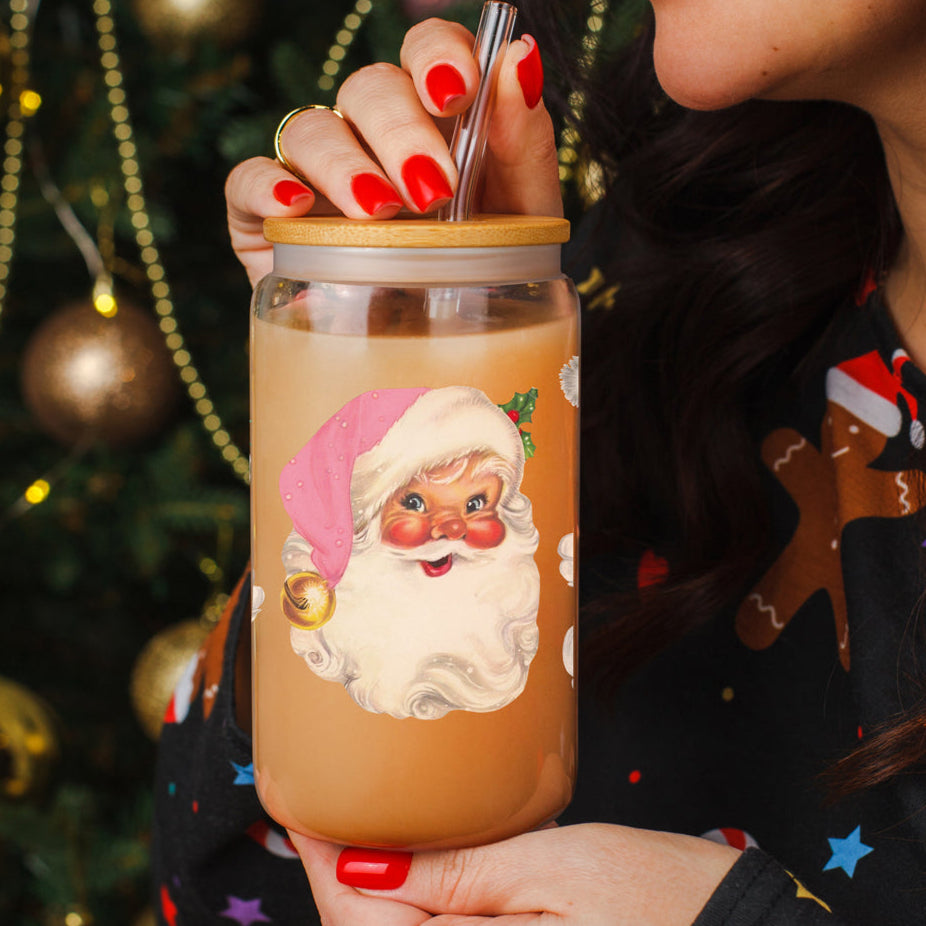 Christmas glass tumbler with pink Santa faces on coffee bar
17oz festive glass cup with vintage pink Santa faces
