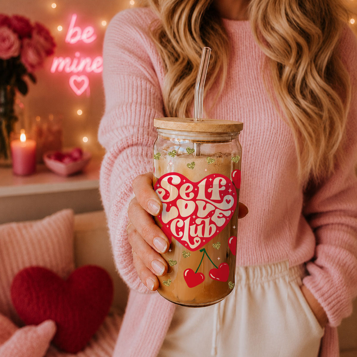 Wholesale 20oz glass cups with bamboo lid and glass straw featuring red hearts and gold glitter for self love gifts.
Women’s empowerment wholesale gifts with Self Love Club 20oz glass cups, bamboo lid, and glass straw.