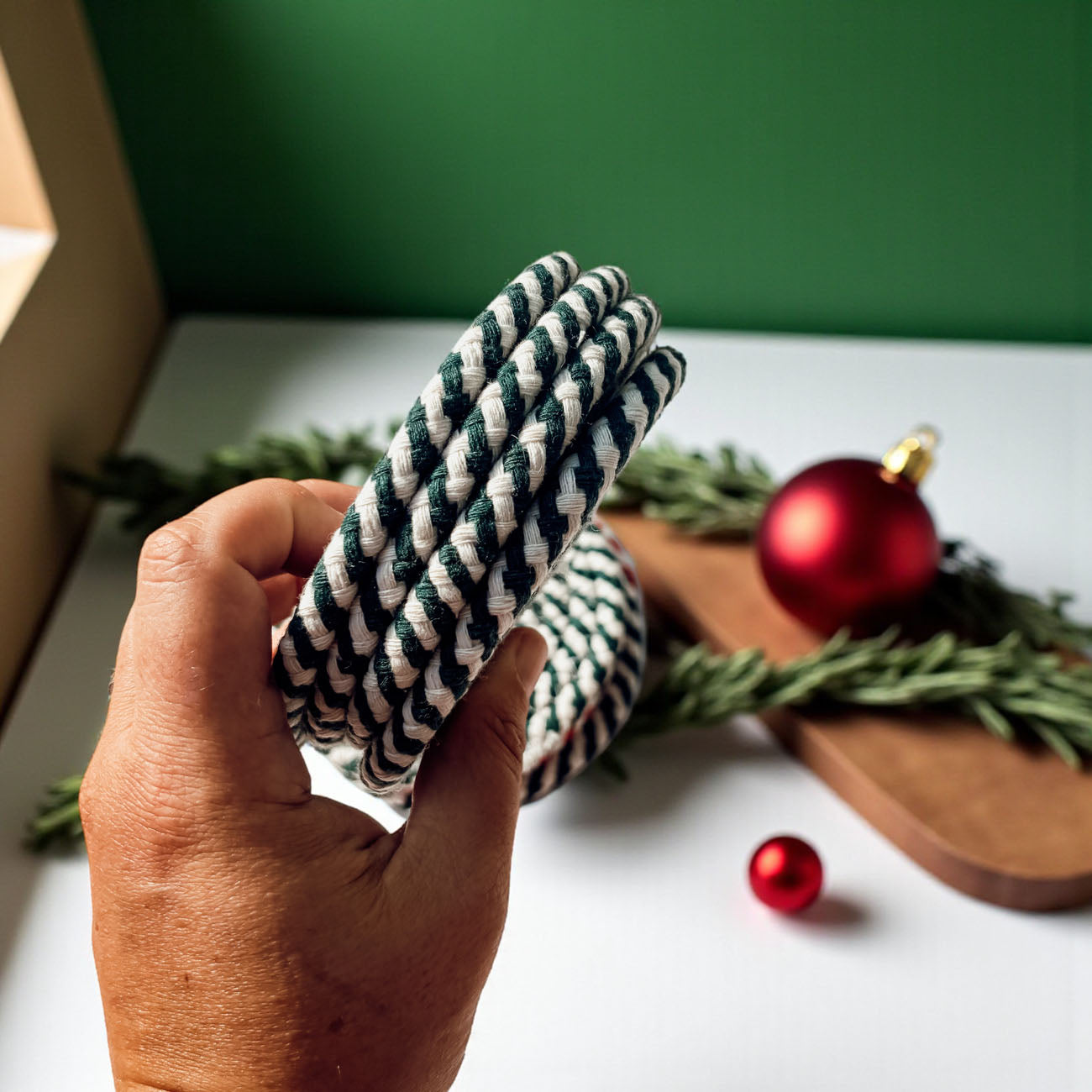 peppermint themed coasters red and white holiday home accents
farmhouse Christmas coasters red and white braided fabric